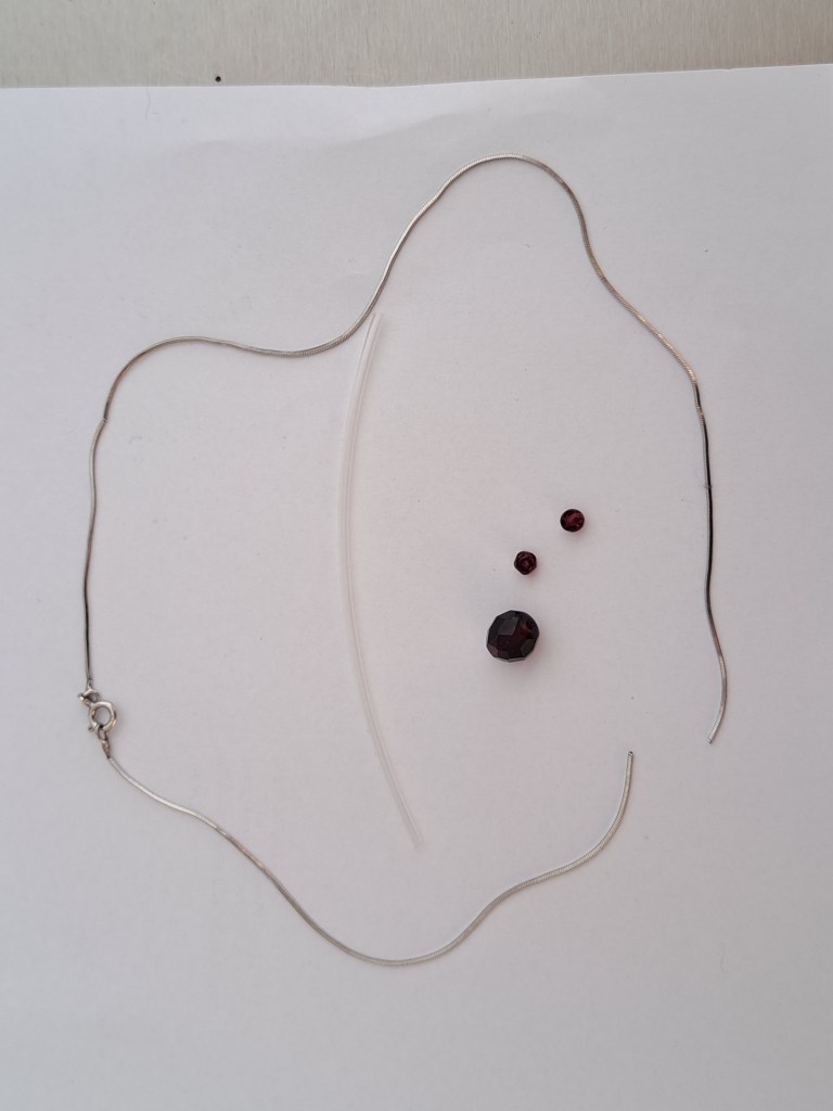 Silver and garnet material. Ready to be reused